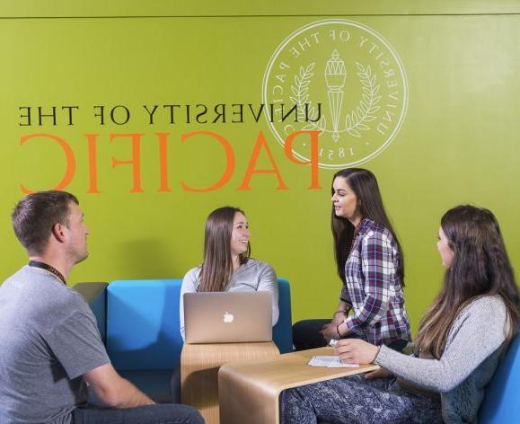 students looking at laptop